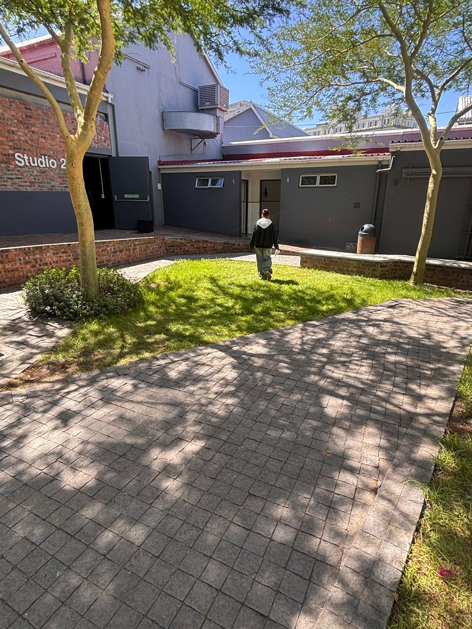Cole Van Der Schyff, founder of Lawn & Order, working on a Cape Town garden